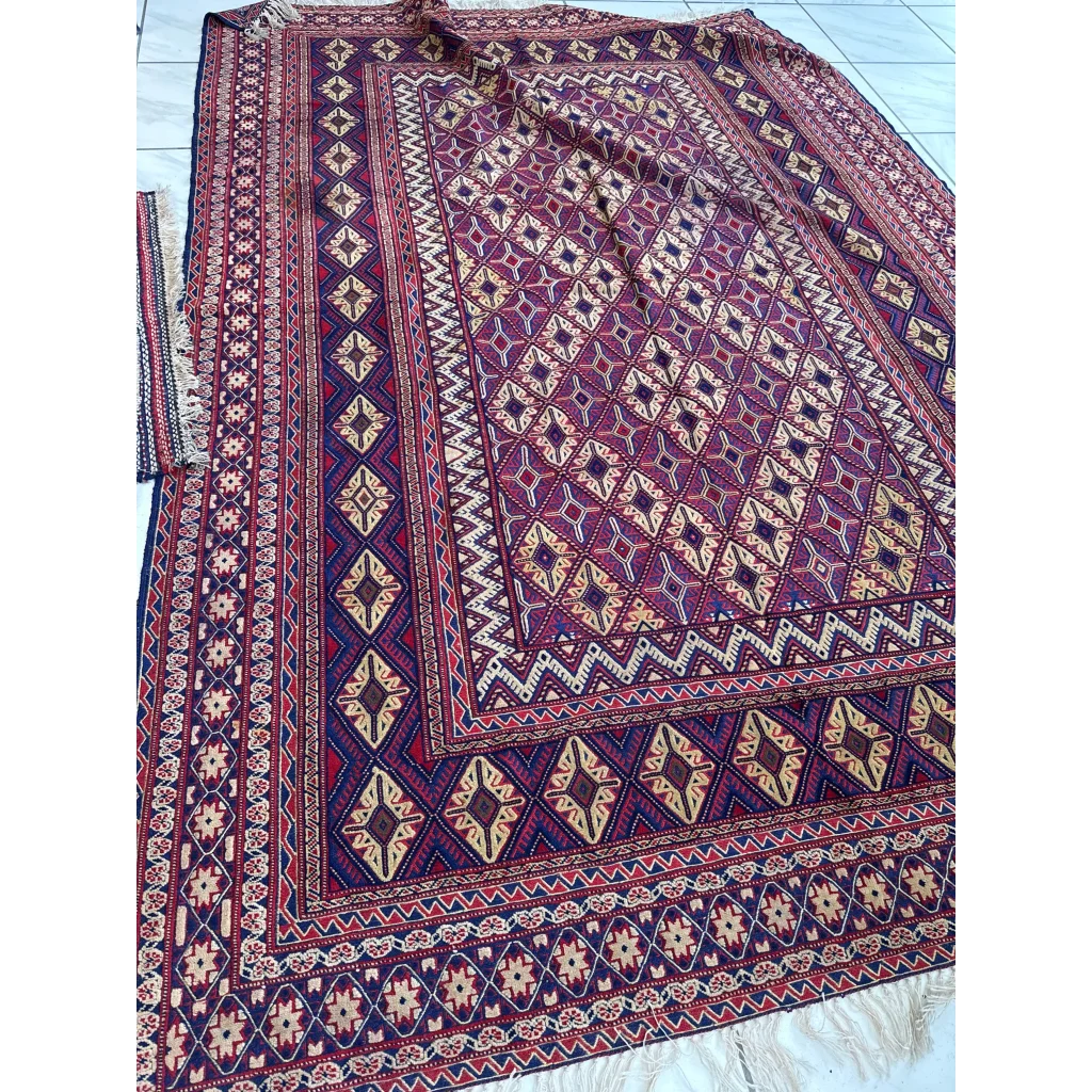 Rich burgundy traditional rug with MLB career floral patterns