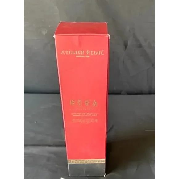 Red rectangular perfume box with gold accents for Atelier Rebul Pera diffuser sticks fragrance