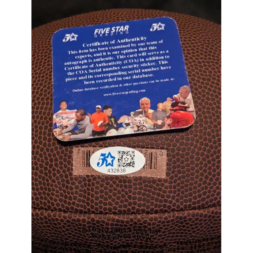 Authentic autographed football with certificate of authenticity and security sticker