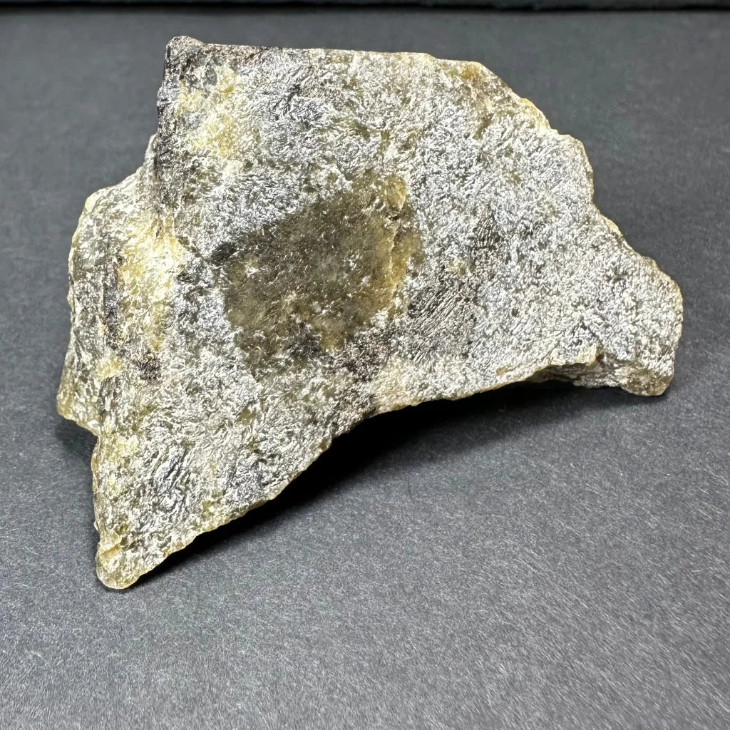 Rough silvery-gray Madagascar labradorite crystal with greenish-yellow patches