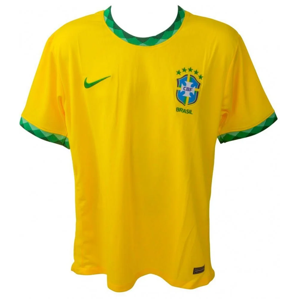 Yellow short-sleeved soccer jersey with green trim featuring Vinicius Junior signature