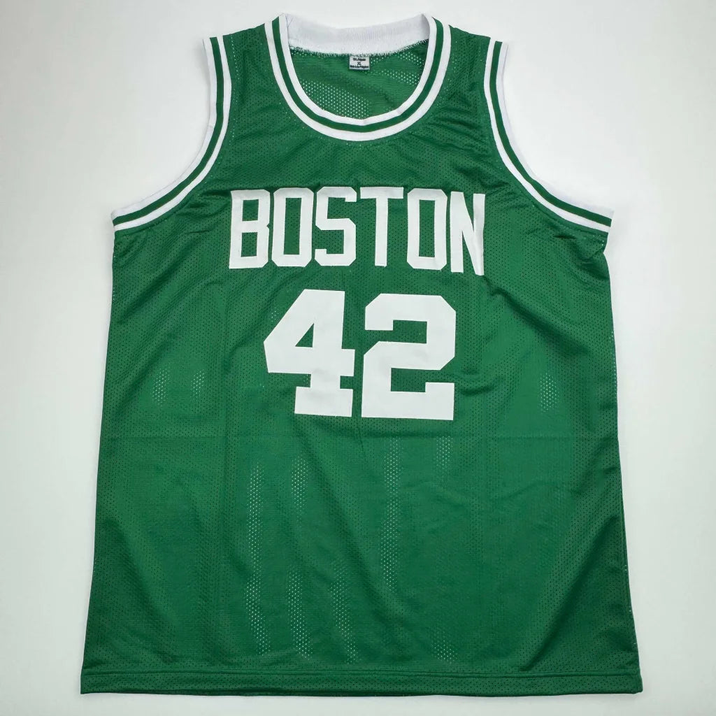 Green custom basketball jersey with white trim and numbers from professional sports league