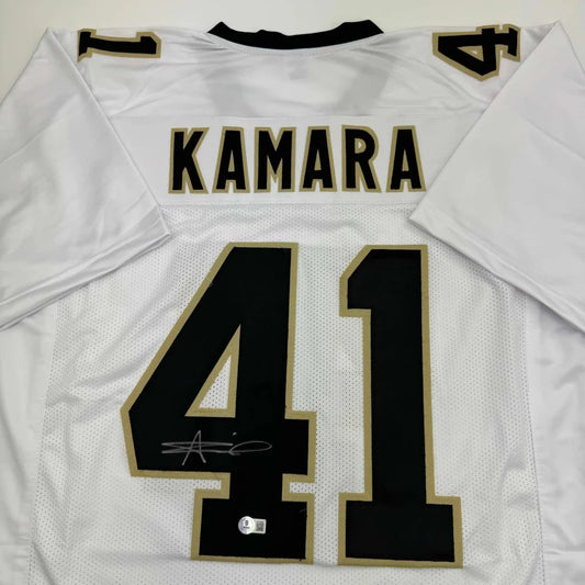 White Kamara 41 custom jersey with black and gold trim, signed from professional sports league
