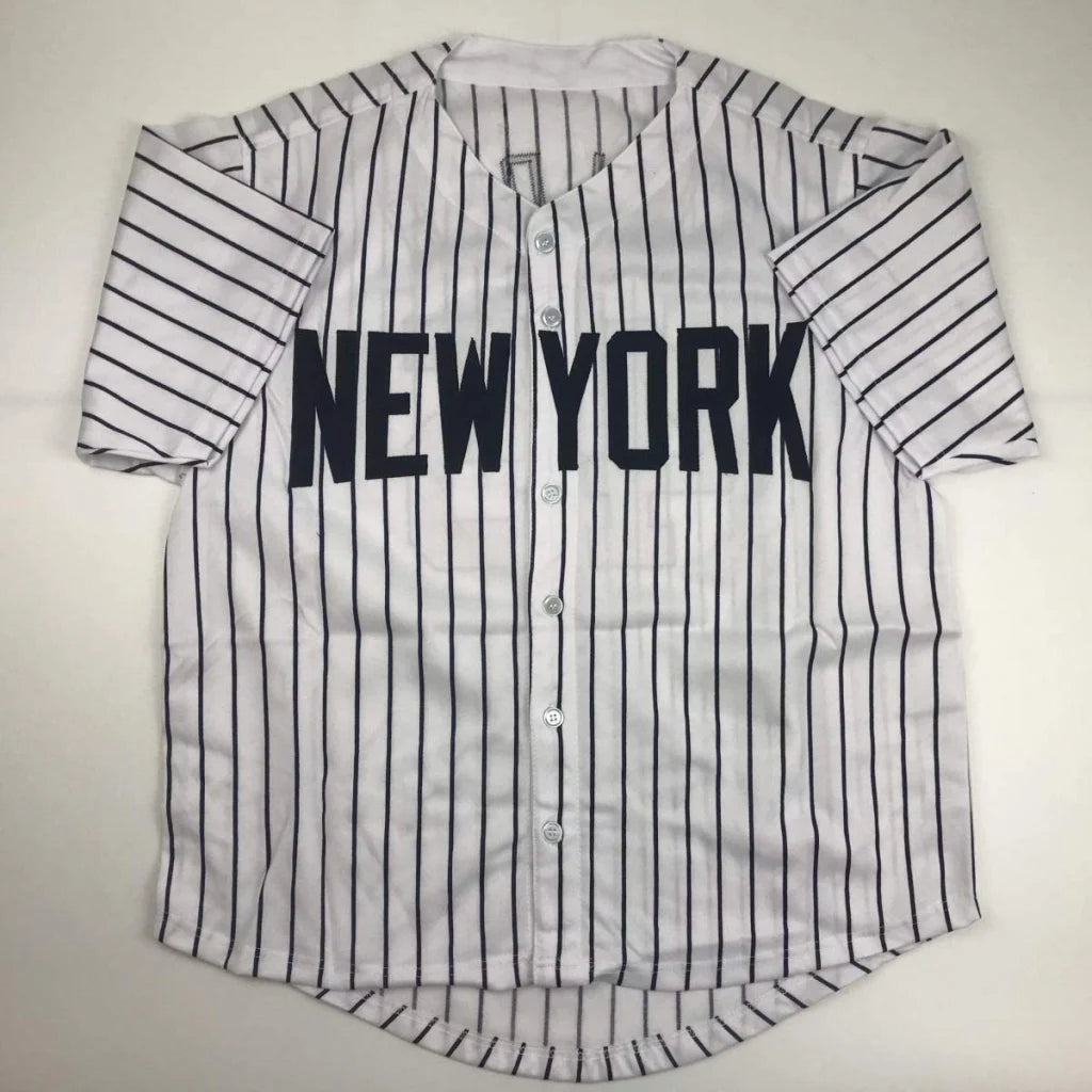 White short-sleeved baseball jersey with black pinstripes and NEW YORK logo for professional sports fans