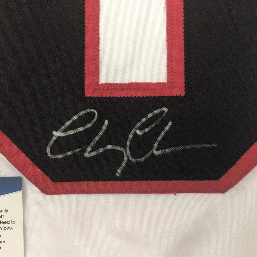 Black custom jersey from Professional Sports League with white red number and autograph