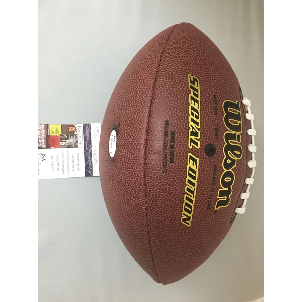 Brown leather NFL football with white laces and dual silver autographs
