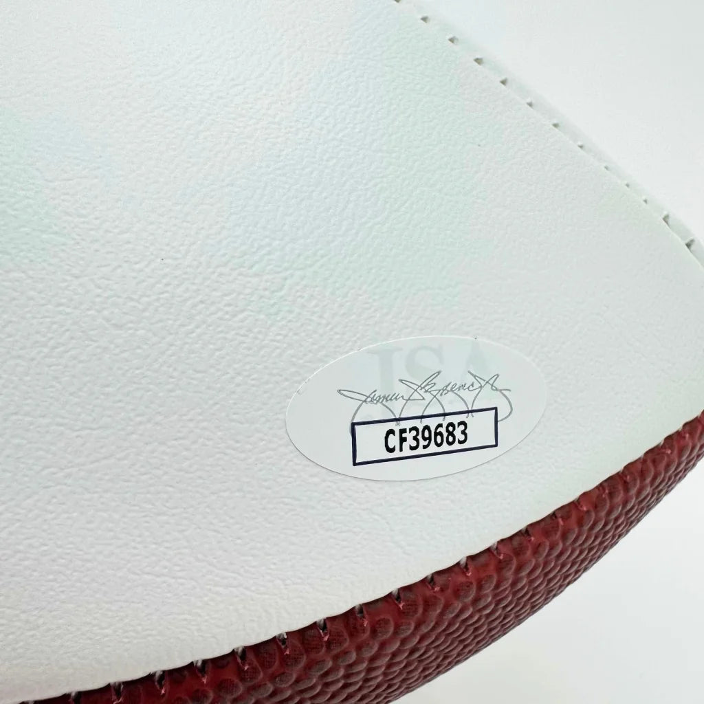 White and brown football with black and white third party authentication sticker