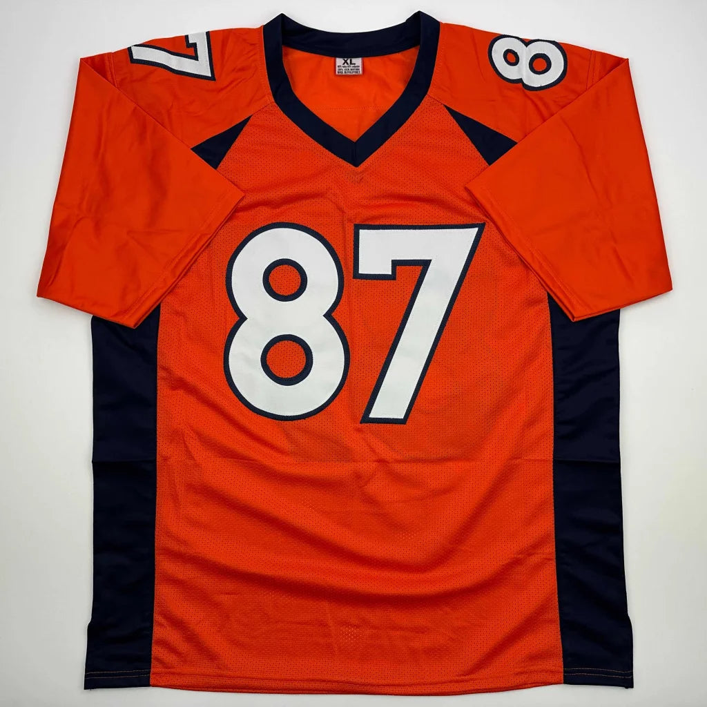 Orange and navy blue Ed McCaffrey professional sports league jersey with number 87