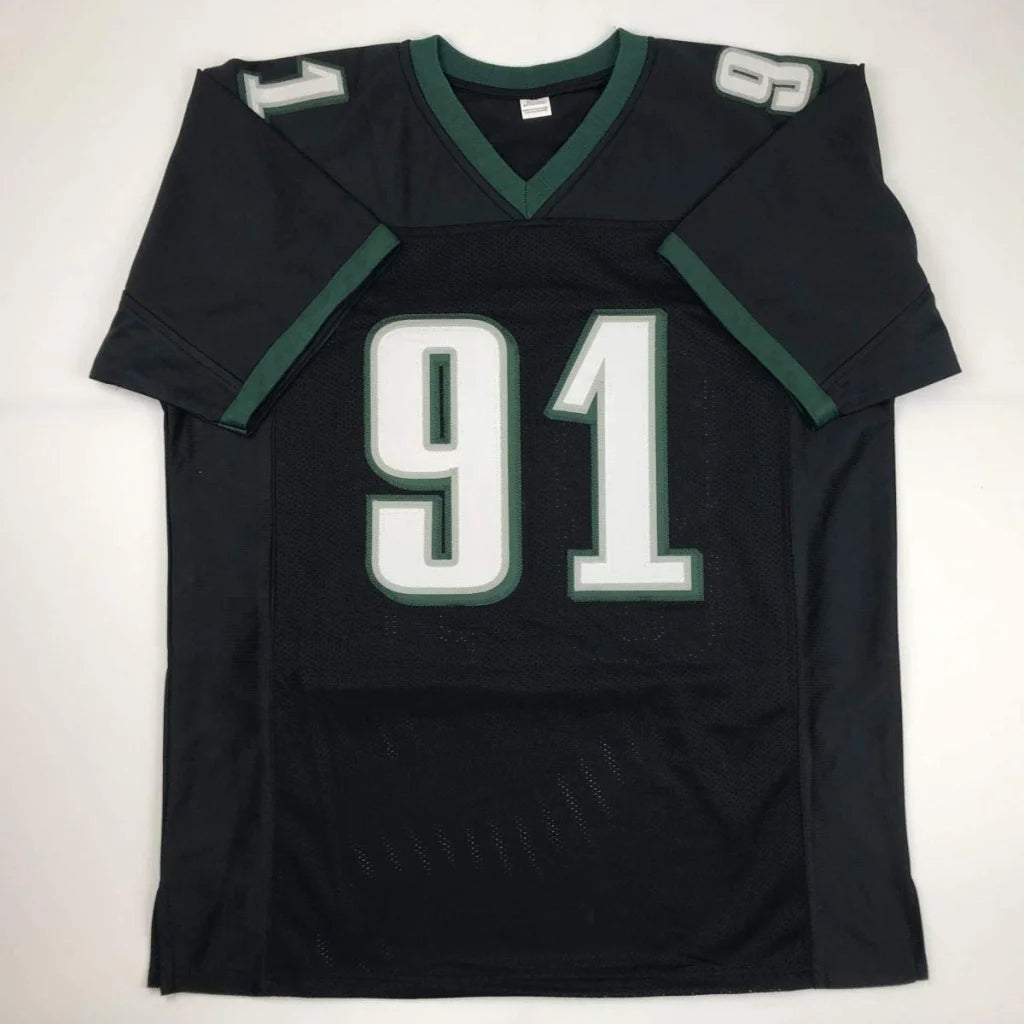 Black athletic jersey with green trim and white numbers from Custom Jersey COX 91 professional sports league