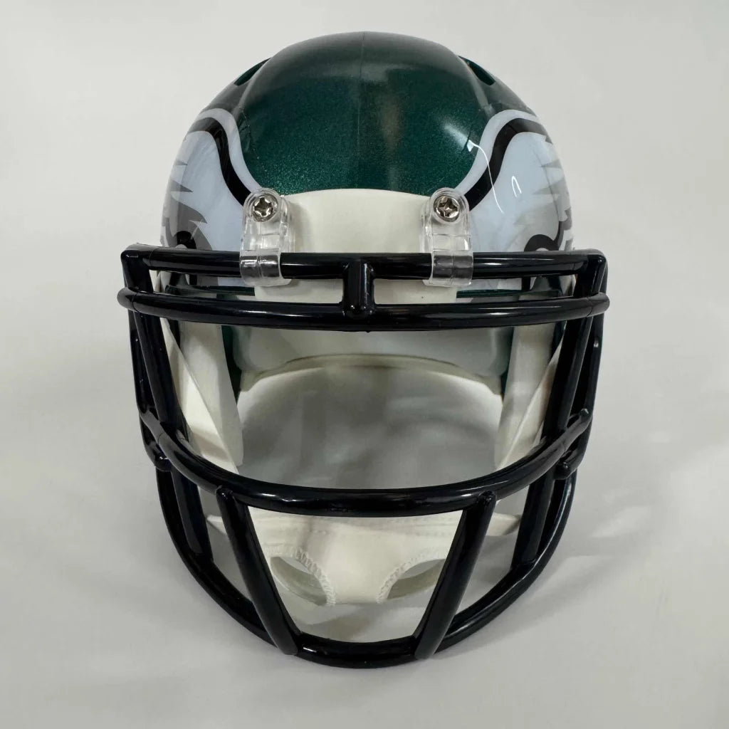 Green and white football helmet with black face mask, authentic third party authentication