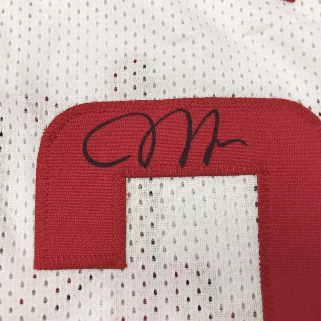 White mesh jersey with red number and black signature for professional sports league gear