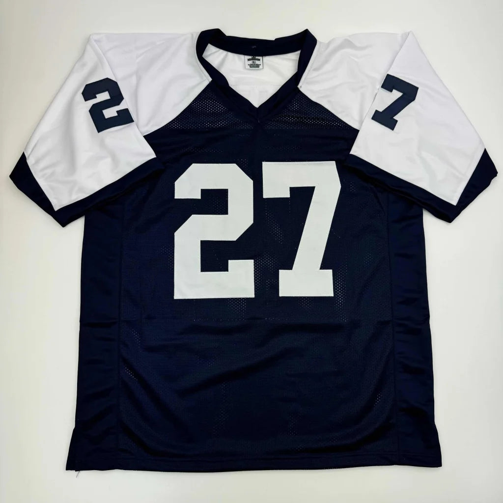Navy blue and white custom football jersey signed by a professional sports legend