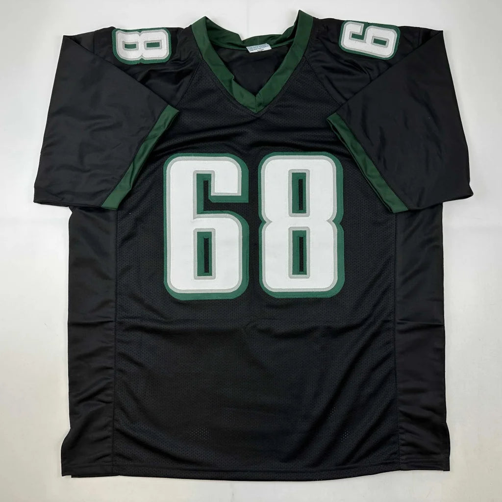 Black and green custom football jersey with number 68 from Rare Mailata in professional sports league
