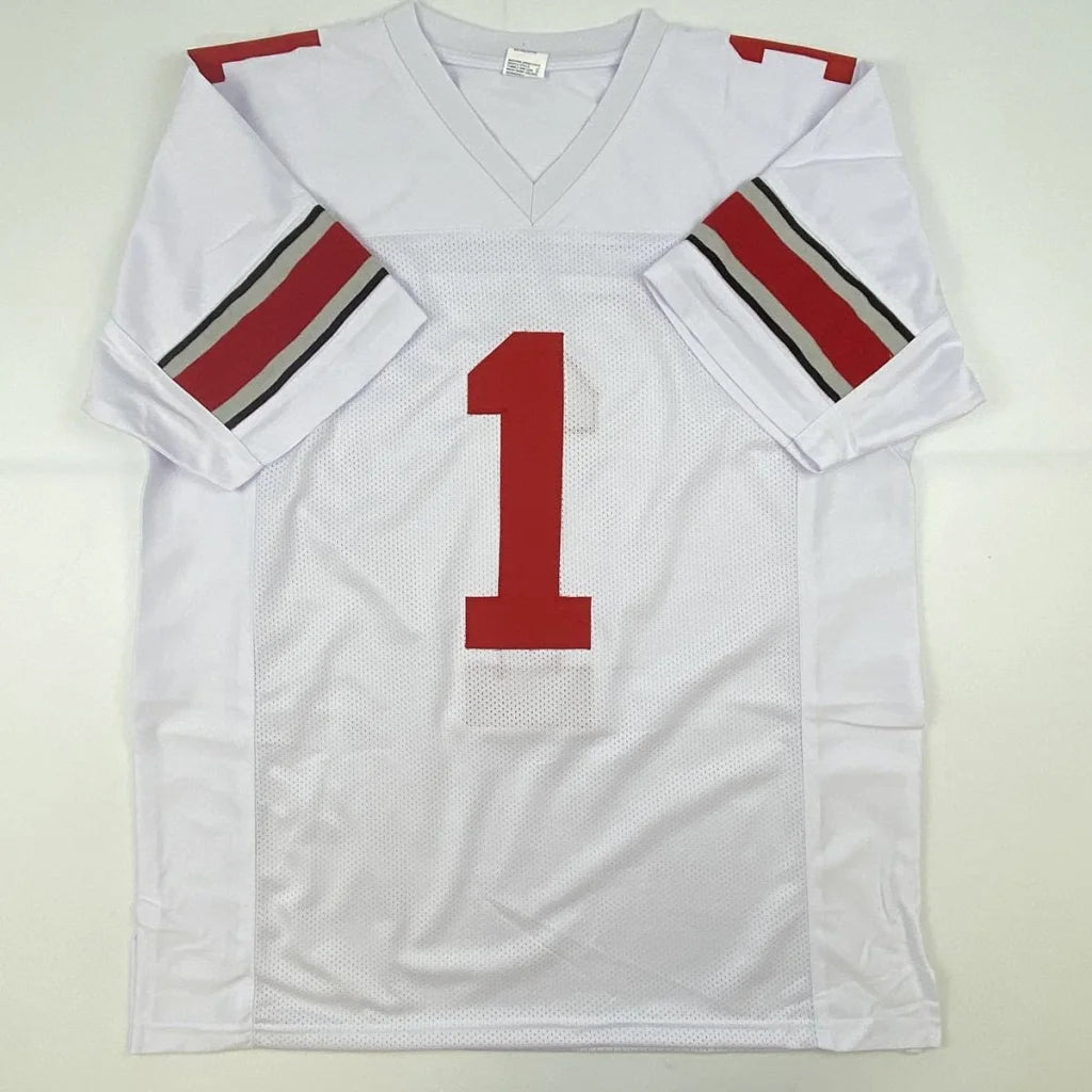 Autographed white ohio state college football custom jersey with red number one and striped sleeves signed by Justin Fields