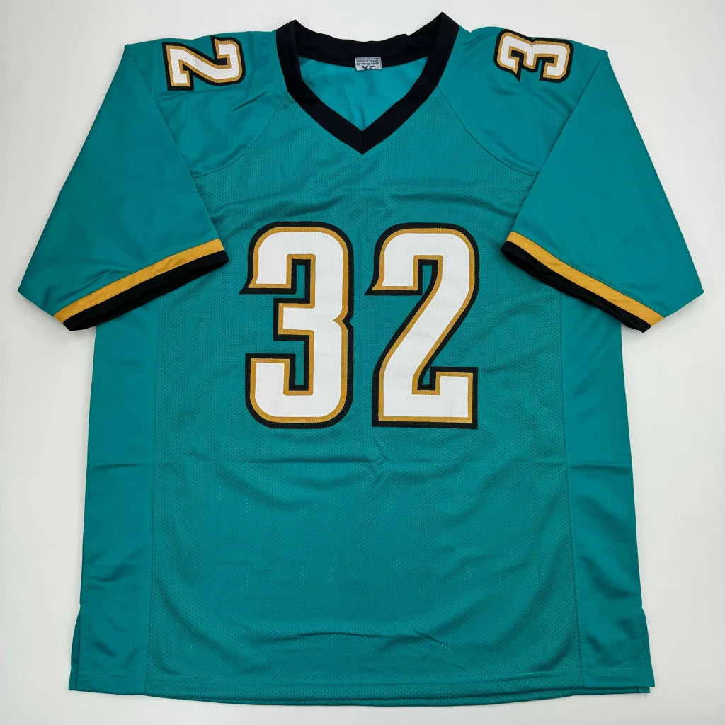 Autographed teal professional sports league jersey with white and gold number 32