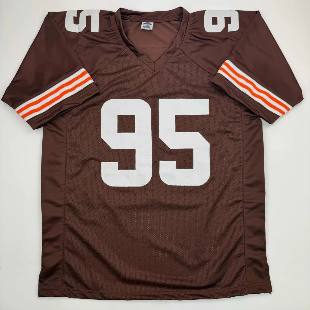 Brown football jersey with white 95, orange and white stripes, perfect for pro sports fans