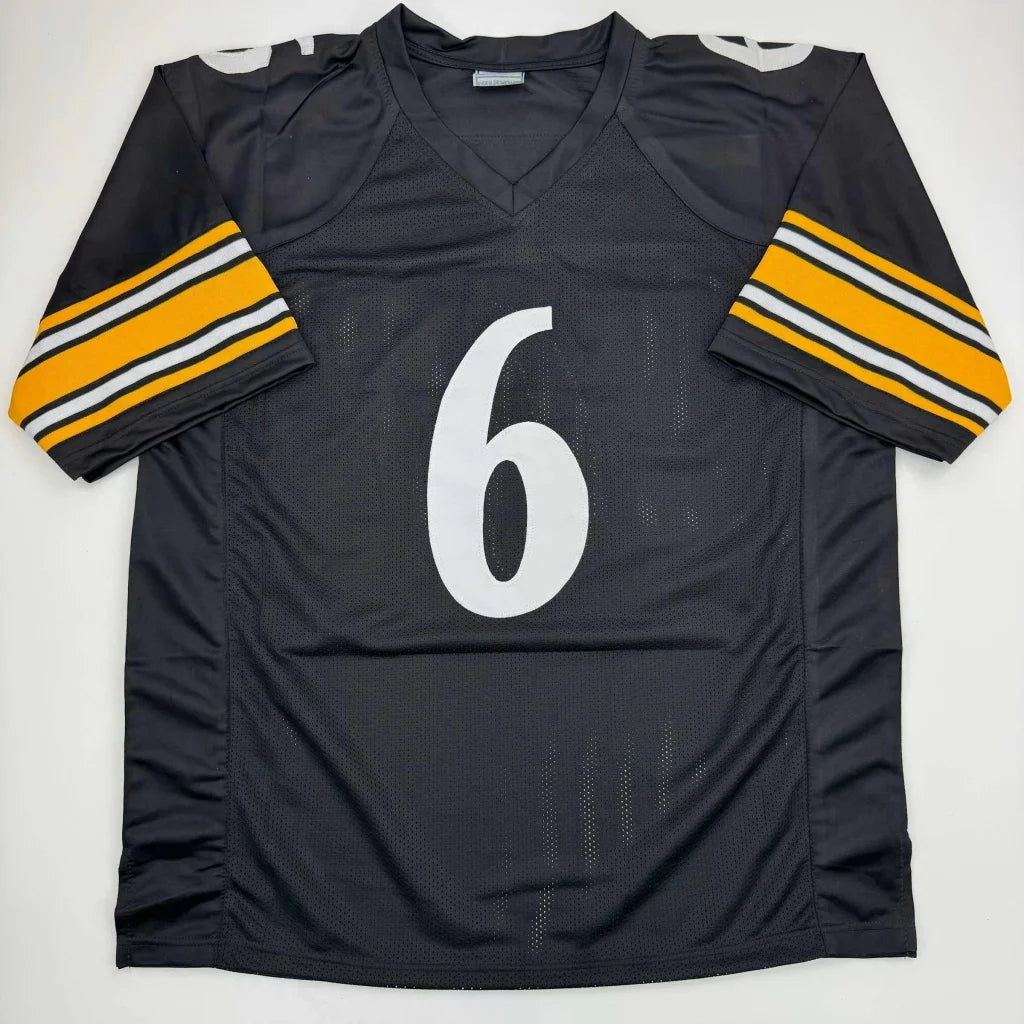 Black custom jersey with white number 6 and yellow white striped sleeves for sports league