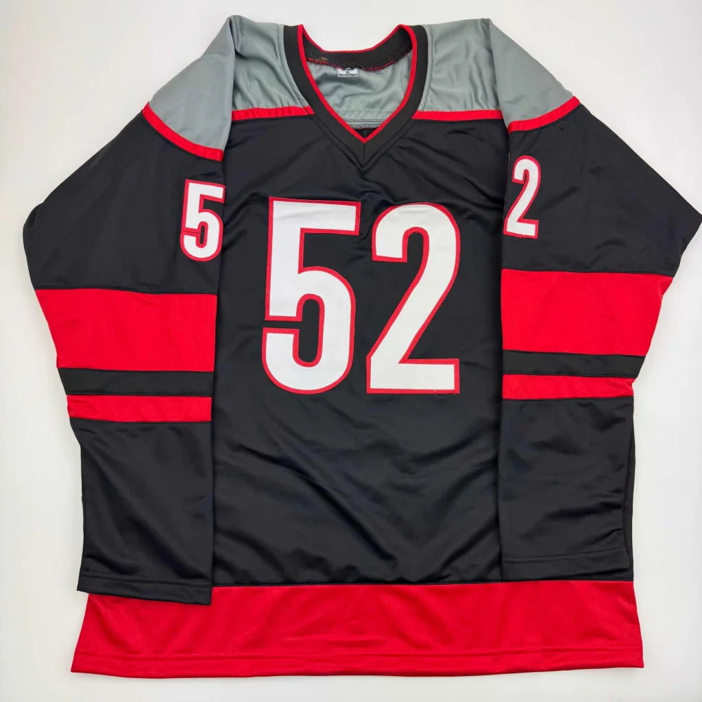 Autographed Pyotr Kochetkov custom black Carolina jersey with number 52
