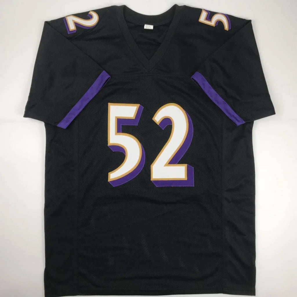Black custom football jersey with purple and white number 52 for professional sports fans