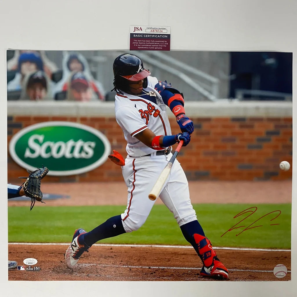 Autographed baseball photo of a player hitting a pitch, in the Authenticated Baseball Action Photo product
