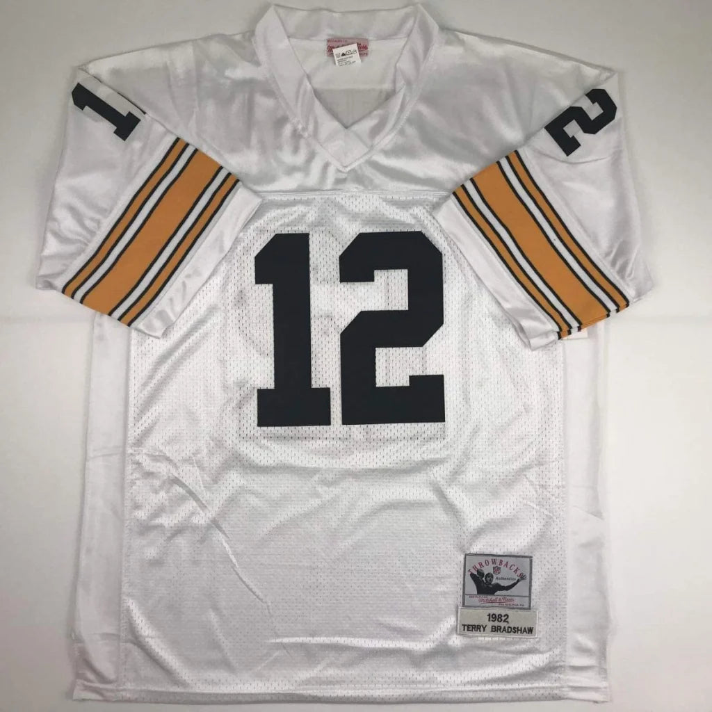Autographed terry bradshaw white mesh custom jersey with black number 12 and mitsubishi tag for professional sports league