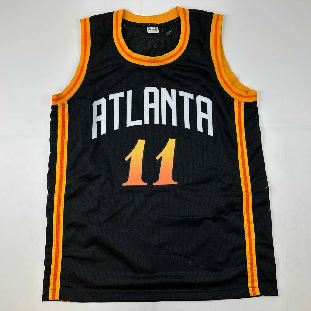 Black basketball jersey with orange and yellow trim from Authentic Custom Jersey in professional sports league collection