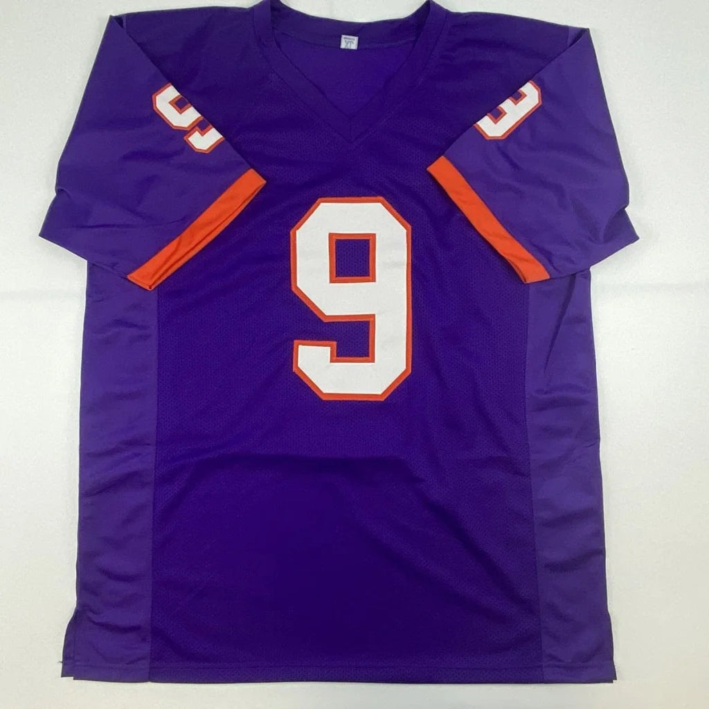 Purple custom jersey with orange and white accents from Travis Etienne’s professional sports collection