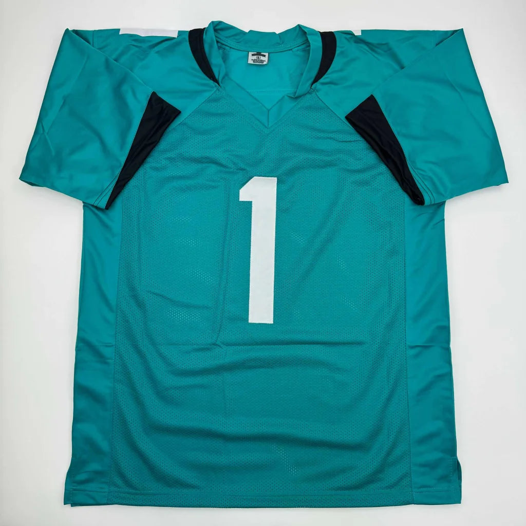 Autographed Travis Etienne Jr. teal custom jersey with white number one