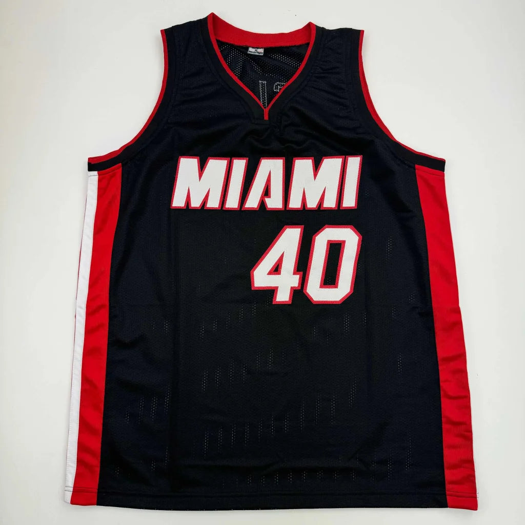 Black Miami Heat basketball jersey with red and white trim from Authentic Haslem professional sports league with Beckett BAS COA