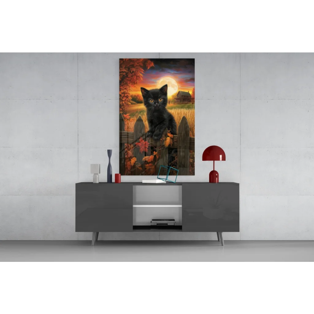 Black cat with glowing yellow eyes on fence, autumn glass wall art print