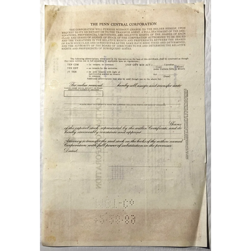 Aged Penn Central stock certificate showcasing vintage 1980s railroad history text