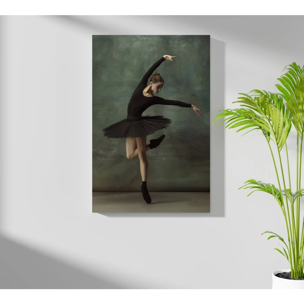 Graceful black ballerina on Insigne aluminum print, mid-pose on green backdrop
