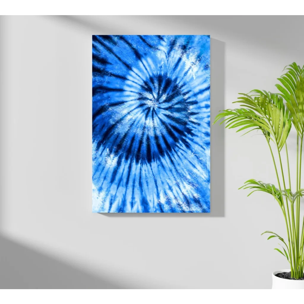 Blue spiral tie-dye canvas art print hanging on wall
