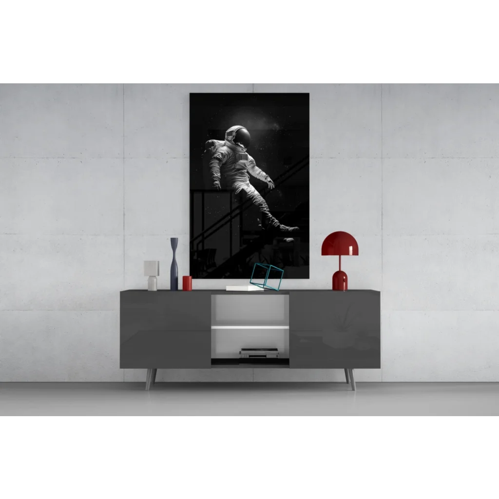 Bold black astronaut glass wall art with white highlights