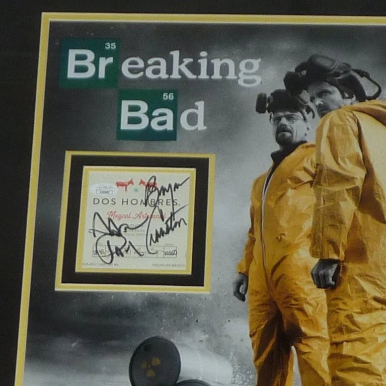 Signed Breaking Bad poster by Cranston and Paul, yellow border black text