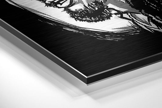 Close-up angled view of brushed aluminum dibond panel edge showing layered black and white printed surface with decorative foliage design.