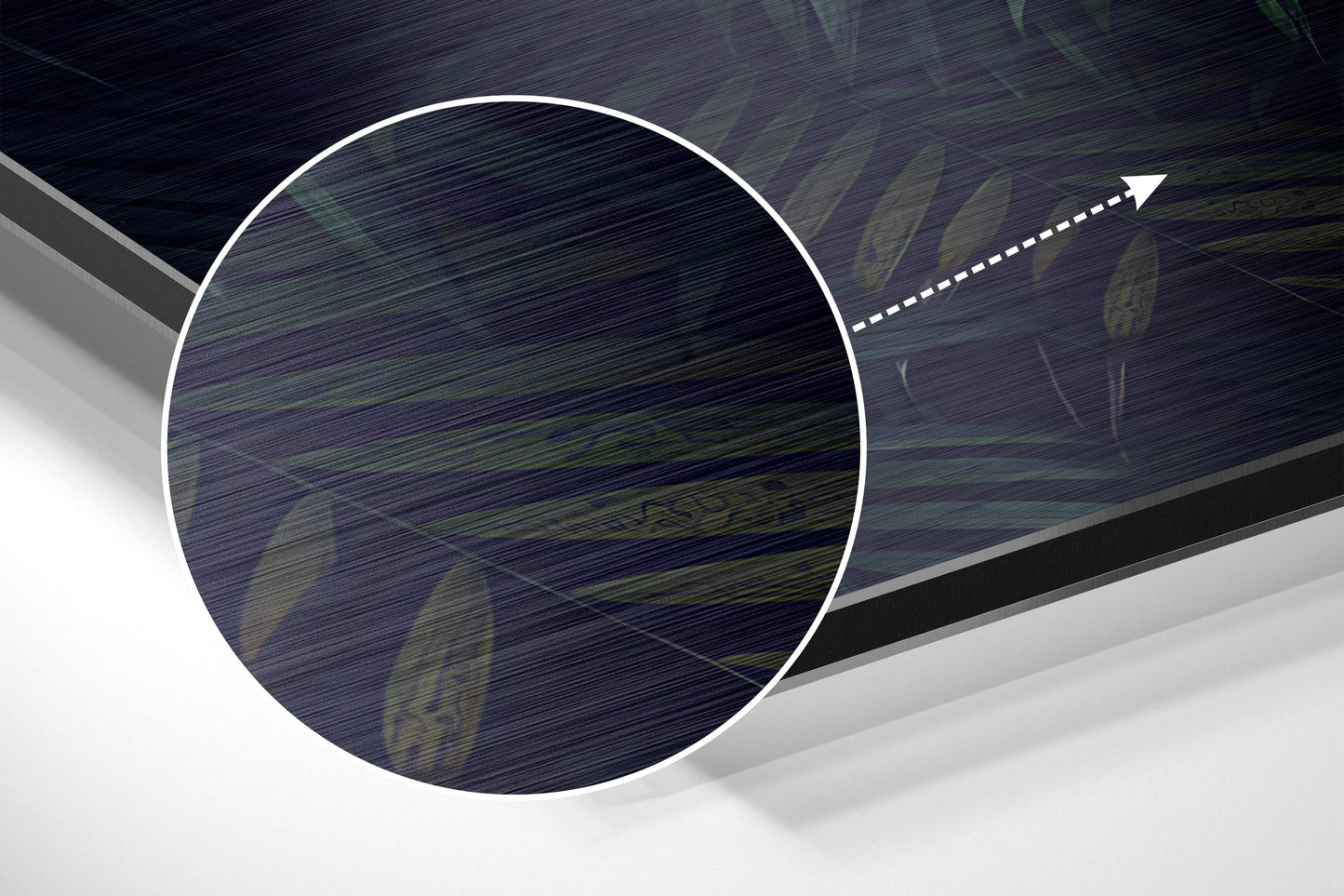 Close-up angled view of brushed aluminum wall art showing textured dark surface with directional arrow overlay and geometric design elements.