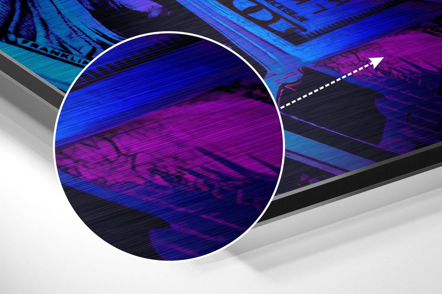 Close-up of brushed aluminium wall art featuring blue and magenta gradient with circled detail and directional arrow indicator.