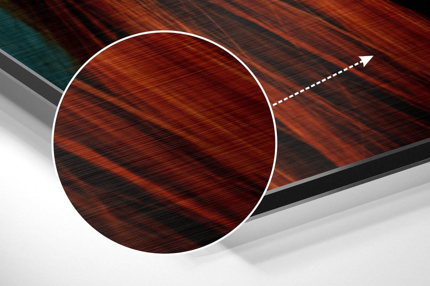 Angled view of circular brushed red-brown aluminum wall art with white border and directional arrow graphic on layered geometric background.