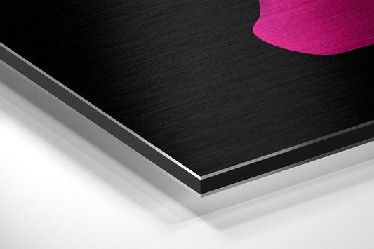 Close-up angled view of layered brushed aluminum and white foam core materials with hot pink curved shape visible at top edge.