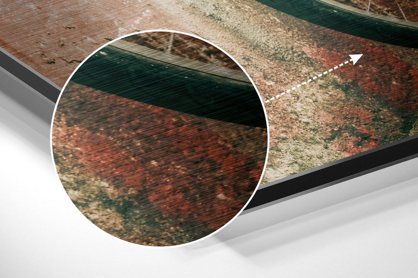 Close-up detail of brushed aluminium dibond wall art showing textured metallic surface with rust and patina coloring in red, green, and tan tones.