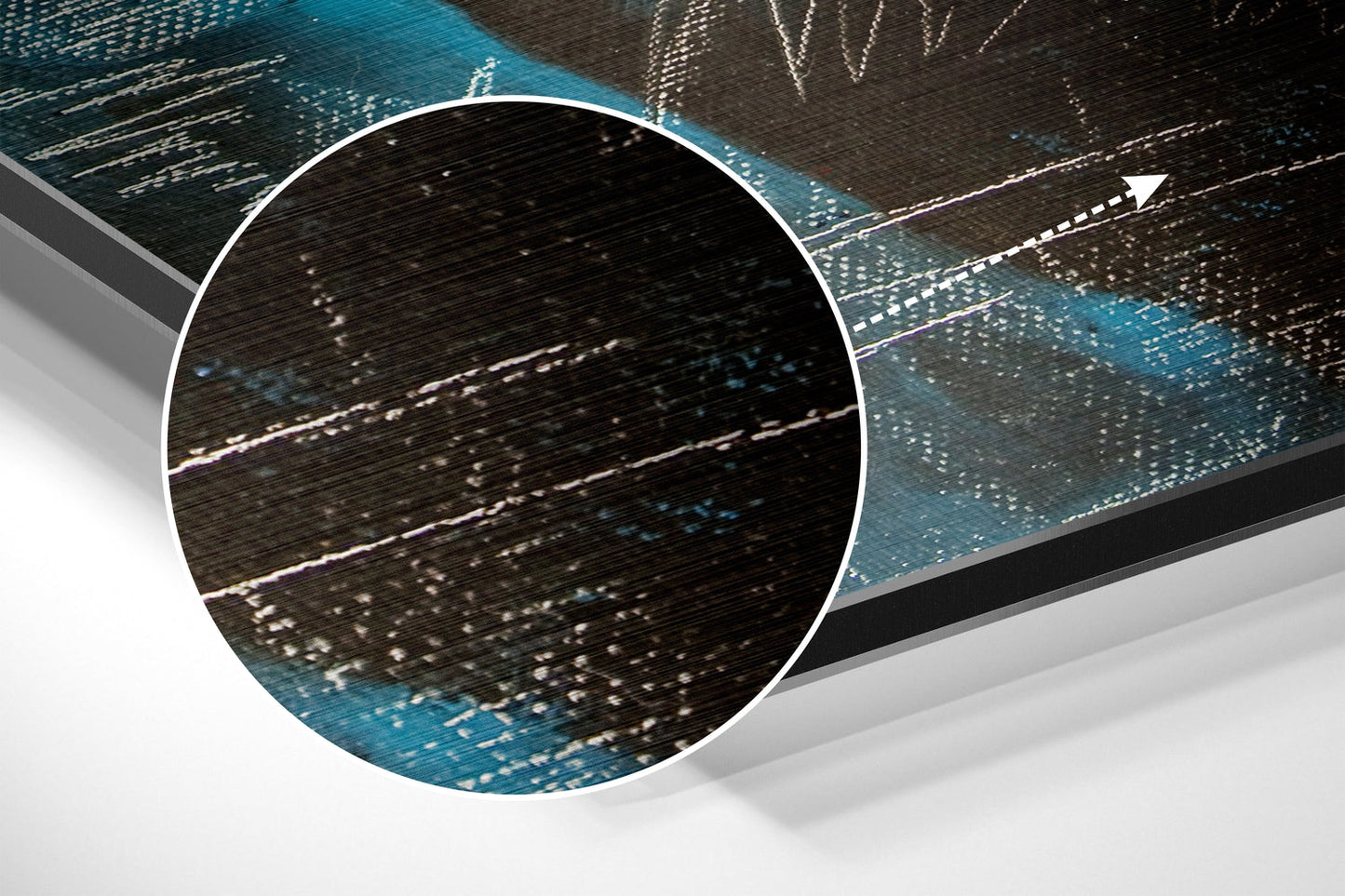 Close-up detail of brushed aluminium surface showing horizontal wood grain texture and blue metallic accents with light reflections.