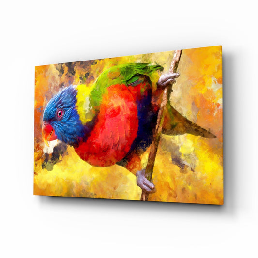 Colorful glass wall art panel depicting a rainbow lorikeet with blue head, red body, and yellow-green wings perched on a branch against warm golden-orange background.