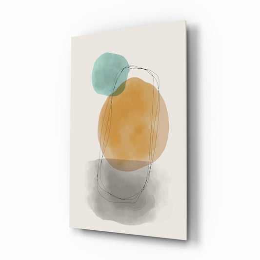 Glass wall art featuring overlapping teal and ochre watercolor shapes with thin line drawings, displayed at an angle against a cream background.