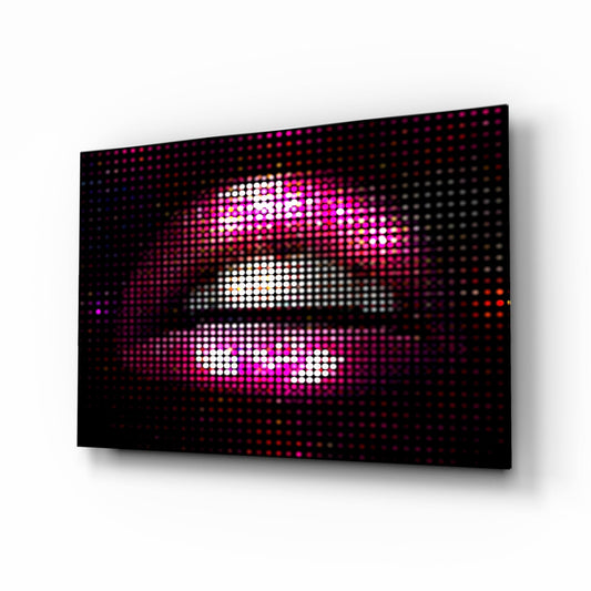 Angled perspective view of LED pixel art glass panel displaying three horizontal pixelated lips in white, magenta, and pink against black background.