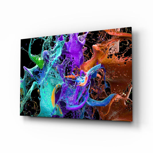 Angled perspective of glass wall art displaying vibrant teal, purple, and orange paint splashes with textured surfaces against black background.