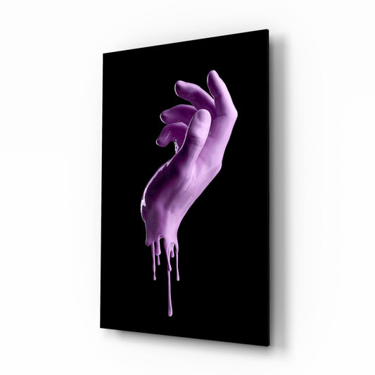 Three-dimensional purple hand sculpture with dripping paint effect mounted on black glass panel, displayed at an angle.