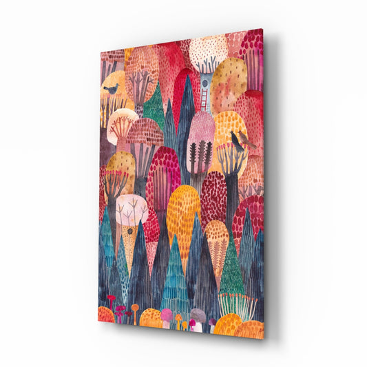Angled three-quarter view of colorful glass wall art featuring whimsical pink, red, orange, and yellow domed trees with textured patterns against dark blue-gray background.