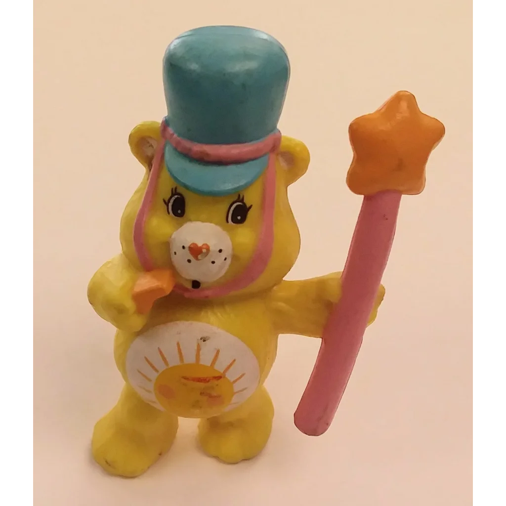 Funshine Bear leading care bears mini parade with pink wand and blue top hat