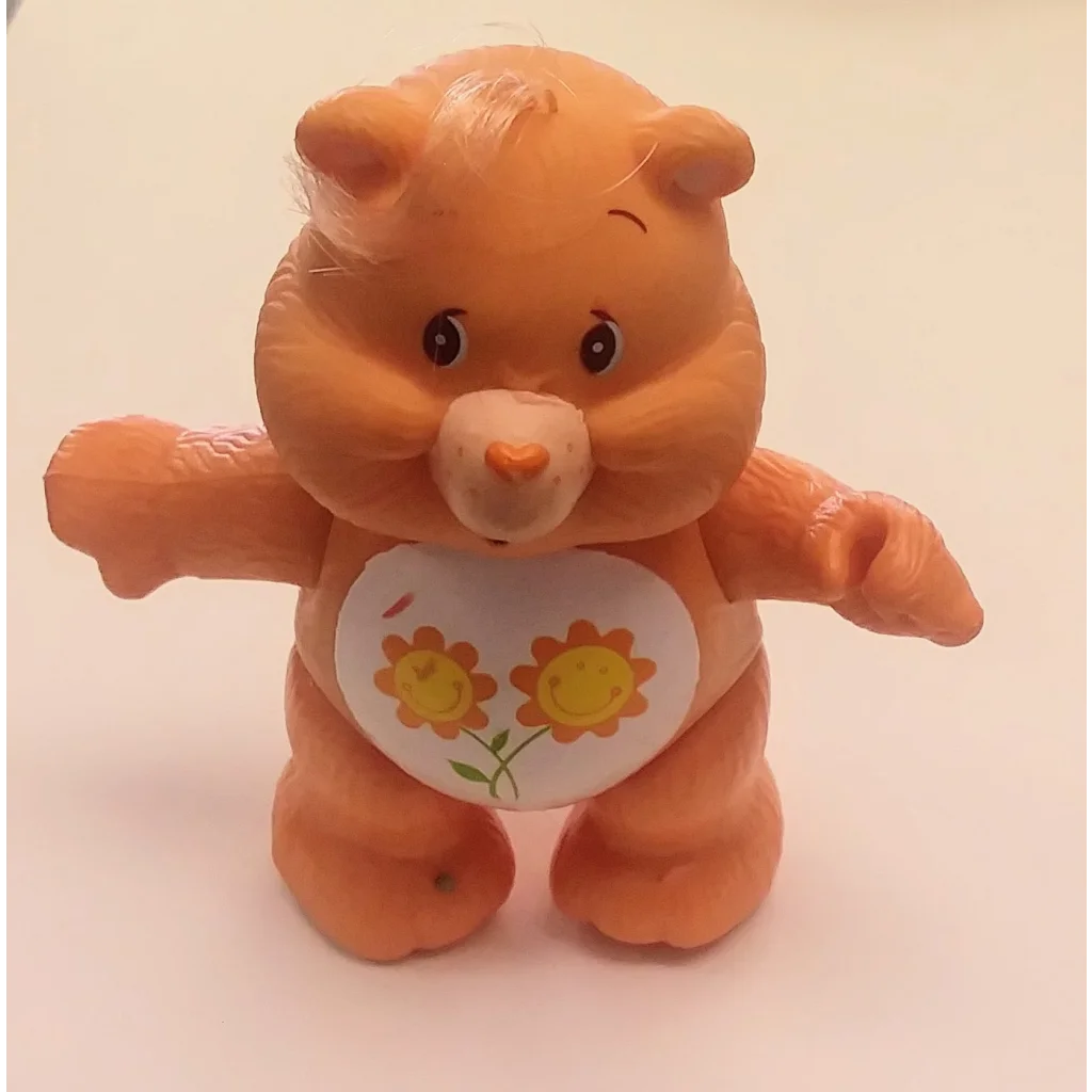 Vintage 1983 Care Bears Friend Bear PVC figure with orange sunflower belly